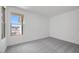 Bright bedroom featuring plush carpeting, natural light, and a view of the neighborhood at 25137 N 171St Ave, Surprise, AZ 85387