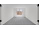 Carpeted bedroom features a window for natural light at 25137 N 171St Ave, Surprise, AZ 85387
