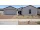 Charming one-story home with neutral exterior, well-kept landscape, and paved driveway at 25137 N 171St Ave, Surprise, AZ 85387