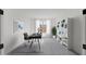 Home office with desk, bookshelves, natural light, and a decorative rug at 25137 N 171St Ave, Surprise, AZ 85387