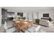 Open floor plan featuring kitchen, dining area, and living room with modern furnishings and decor at 25137 N 171St Ave, Surprise, AZ 85387