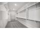 Large walk-in closet with built-in shelving, hanging rods, and carpeted floor at 25137 N 171St Ave, Surprise, AZ 85387
