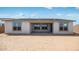 Rear of home with covered patio and ample windows overlooking a large, blank backyard ready for landscaping at 25149 N 171St Ave, Surprise, AZ 85387