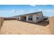 Spacious dirt backyard, fully enclosed with block wall, provides a blank canvas for outdoor living at 25149 N 171St Ave, Surprise, AZ 85387