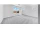 Spacious bedroom featuring plush carpeting, white walls, and bright windows at 25149 N 171St Ave, Surprise, AZ 85387