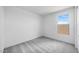 Simple bedroom with neutral carpet, white walls, and natural light at 25149 N 171St Ave, Surprise, AZ 85387
