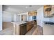 Spacious kitchen with an island, stainless steel appliances, and wood-look tile flooring at 25149 N 171St Ave, Surprise, AZ 85387