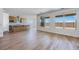 Open-concept living space with kitchen view and large windows at 25149 N 171St Ave, Surprise, AZ 85387