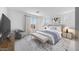 Well-appointed main bedroom featuring a large bed, sitting area, and ample natural light at 25149 N 171St Ave, Surprise, AZ 85387