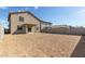 Large, flat backyard with a covered patio and block wall fencing at 8552 N 170Th Ln, Waddell, AZ 85355