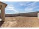 A large backyard with plenty of space for outdoor activities and a covered patio at 8552 N 170Th Ln, Waddell, AZ 85355