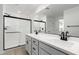 Bright bathroom showcases a double sink vanity with a stand-up shower boasting sleek, modern design at 8552 N 170Th Ln, Waddell, AZ 85355