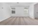 Large bedroom features plush neutral carpet and two windows, creating a comfortable and bright atmosphere for relaxation at 8552 N 170Th Ln, Waddell, AZ 85355