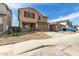 Two-story home featuring red shutters and a two car garage with desert landscaping at 8552 N 170Th Ln, Waddell, AZ 85355
