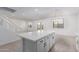 Bright kitchen boasts a large center island with white cabinets and a smooth countertop, perfect for food prep and entertaining at 8552 N 170Th Ln, Waddell, AZ 85355