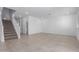 Spacious living room showcases tile floors, staircase, and access to a powder room, perfect for entertaining or relaxing at 8552 N 170Th Ln, Waddell, AZ 85355