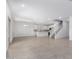 Open concept living space featuring tile floors, staircase, and kitchen access at 8552 N 170Th Ln, Waddell, AZ 85355