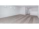 Upstairs loft boasts plush neutral carpet, creating a cozy and inviting additional living space for various activities at 8552 N 170Th Ln, Waddell, AZ 85355