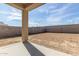 Covered patio providing shade and views of the spacious backyard with block fencing at 8552 N 170Th Ln, Waddell, AZ 85355