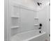 Modern bathroom features a pristine white shower and sleek fixtures for a clean and luxurious feel at 8552 N 170Th Ln, Waddell, AZ 85355