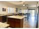 Modern kitchen with granite countertops, a central island, and stainless steel appliances, great for cooking at 1095 W Desert Valley Dr, San Tan Valley, AZ 85143