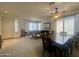 Spacious living area with a seamless flow to the dining space, enhanced by natural light and inviting decor at 1095 W Desert Valley Dr, San Tan Valley, AZ 85143
