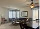 Inviting living room with a comfortable couch, dining table, and bright windows for a relaxing atmosphere at 1095 W Desert Valley Dr, San Tan Valley, AZ 85143