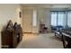 Welcoming entryway leads to a spacious living area with dining table, natural light and comfortable seating at 1095 W Desert Valley Dr, San Tan Valley, AZ 85143