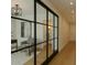 Bright, modern home with glass dividers, neutral walls, hardwood floors, and elegant decor at 88 N Country Club Dr, Phoenix, AZ 85014
