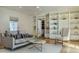 Elegant living room featuring custom built-in shelves, hardwood floors, and modern furnishings at 88 N Country Club Dr, Phoenix, AZ 85014