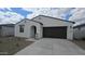 Charming single-story home featuring a two-car garage, low maintenance yard, and stucco siding at 37600 N Cowboy Ln, San Tan Valley, AZ 85140