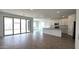 Open concept living space featuring sliding glass doors, tile floors, and modern fixtures at 37600 N Cowboy Ln, San Tan Valley, AZ 85140