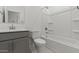 Bright bathroom featuring a bathtub, toilet and gray vanity with white countertops and modern fixtures at 7449 S 75Th Dr, Laveen, AZ 85339