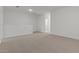 A bright and spacious room with carpet and white walls offers versatility for various living arrangements at 7449 S 75Th Dr, Laveen, AZ 85339