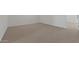 A bright carpeted room with white walls offers a clean and modern living space at 7449 S 75Th Dr, Laveen, AZ 85339