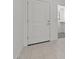 Bright entryway with tile flooring, white door, and view of a walk-in closet at 7449 S 75Th Dr, Laveen, AZ 85339
