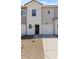 Charming townhome with a single-car garage, well-kept front yard, and inviting entrance at 7449 S 75Th Dr, Laveen, AZ 85339