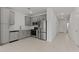 Bright kitchen featuring modern stainless steel appliances and sleek gray cabinetry at 7449 S 75Th Dr, Laveen, AZ 85339