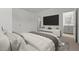 Well decorated main bedroom featuring a flat screen television and a bright ensuite bathroom at 7449 S 75Th Dr, Laveen, AZ 85339