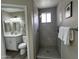 This is a bathroom with double sinks, and a walk in shower at 15075 W Amelia Dr, Goodyear, AZ 85395