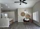 Dining area with modern table and chairs adjacent to the open kitchen at 15075 W Amelia Dr, Goodyear, AZ 85395