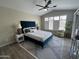 Relaxing main bedroom with neutral walls, a plush bed, and plantation shutters at 15075 W Amelia Dr, Goodyear, AZ 85395