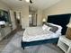Spacious main bedroom with neutral decor, stylish furnishings, and ample natural light at 15075 W Amelia Dr, Goodyear, AZ 85395