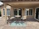 Covered patio features two chairs and a small table at 15075 W Amelia Dr, Goodyear, AZ 85395