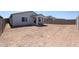 Expansive backyard, enclosed by block fencing, ready for customization and personalization at 40010 W Bravo Dr, Maricopa, AZ 85138