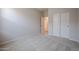 Bedroom featuring carpet flooring and a closet with sliding doors at 40010 W Bravo Dr, Maricopa, AZ 85138