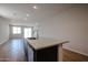 Kitchen island with stainless steel sink and granite countertops at 40010 W Bravo Dr, Maricopa, AZ 85138