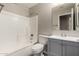 Clean bathroom with a shower/tub combo and gray vanity at 574 W Kingman Dr, Casa Grande, AZ 85122