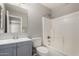 Clean bathroom with tub, shower, and gray vanity at 574 W Kingman Dr, Casa Grande, AZ 85122