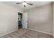 Bedroom with door to kitchen and ceiling fan at 574 W Kingman Dr, Casa Grande, AZ 85122